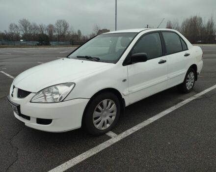 Белый Мицубиси Лансер, объемом двигателя 1.6 л и пробегом 306 тыс. км за 3000 $, фото 5 на Automoto.ua