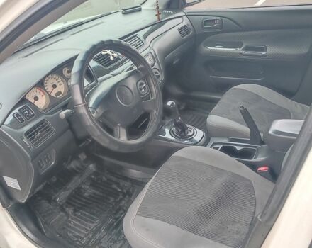 Белый Мицубиси Лансер, объемом двигателя 1.6 л и пробегом 306 тыс. км за 3000 $, фото 13 на Automoto.ua