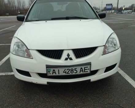 Белый Мицубиси Лансер, объемом двигателя 1.6 л и пробегом 306 тыс. км за 3000 $, фото 6 на Automoto.ua