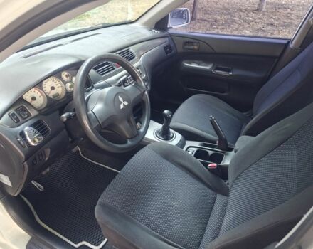 Білий Міцубісі Lancer, об'ємом двигуна 1.6 л та пробігом 400 тис. км за 4100 $, фото 12 на Automoto.ua