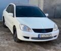Белый Мицубиси Лансер, объемом двигателя 1.6 л и пробегом 250 тыс. км за 2999 $, фото 1 на Automoto.ua