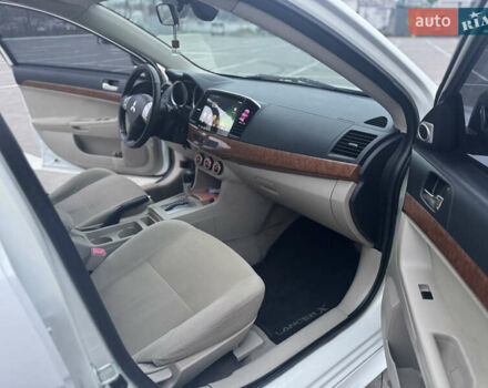 Белый Мицубиси Лансер, объемом двигателя 1.5 л и пробегом 314 тыс. км за 6500 $, фото 17 на Automoto.ua