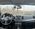 Білий Міцубісі Lancer, об'ємом двигуна 2 л та пробігом 215 тис. км за 7700 $, фото 6 на Automoto.ua