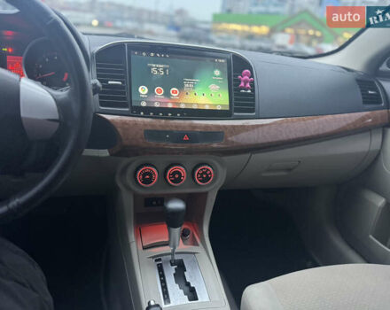 Белый Мицубиси Лансер, объемом двигателя 1.5 л и пробегом 314 тыс. км за 6500 $, фото 24 на Automoto.ua