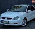 Білий Міцубісі Lancer, об'ємом двигуна 1.58 л та пробігом 217 тис. км за 3299 $, фото 1 на Automoto.ua