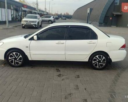 Білий Міцубісі Lancer, об'ємом двигуна 1.58 л та пробігом 250 тис. км за 4400 $, фото 8 на Automoto.ua