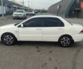 Білий Міцубісі Lancer, об'ємом двигуна 1.58 л та пробігом 250 тис. км за 4400 $, фото 8 на Automoto.ua