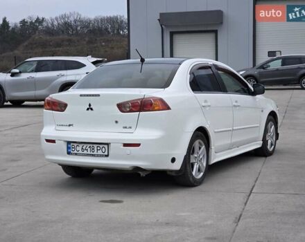 Белый Мицубиси Лансер, объемом двигателя 2 л и пробегом 218 тыс. км за 5555 $, фото 5 на Automoto.ua
