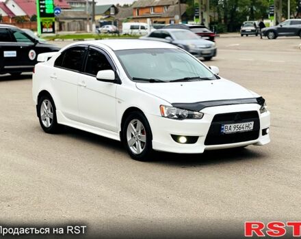 Белый Мицубиси Лансер, объемом двигателя 2 л и пробегом 185 тыс. км за 7999 $, фото 6 на Automoto.ua