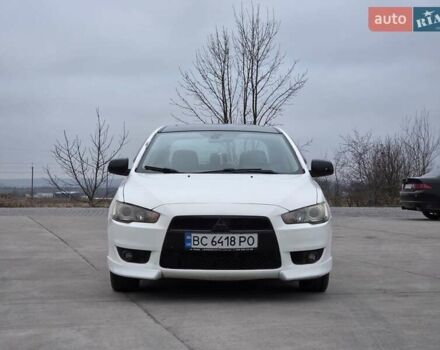 Белый Мицубиси Лансер, объемом двигателя 2 л и пробегом 218 тыс. км за 5555 $, фото 6 на Automoto.ua