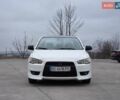 Белый Мицубиси Лансер, объемом двигателя 2 л и пробегом 218 тыс. км за 5555 $, фото 6 на Automoto.ua