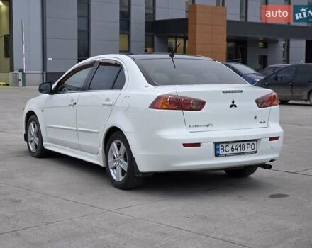 Белый Мицубиси Лансер, объемом двигателя 2 л и пробегом 218 тыс. км за 5555 $, фото 2 на Automoto.ua