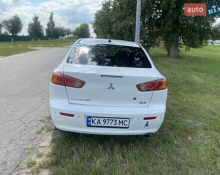 Белый Мицубиси Лансер, объемом двигателя 2 л и пробегом 167 тыс. км за 7400 $, фото 13 на Automoto.ua