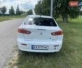 Белый Мицубиси Лансер, объемом двигателя 2 л и пробегом 167 тыс. км за 7400 $, фото 13 на Automoto.ua