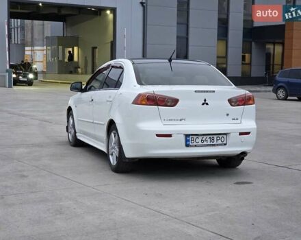 Белый Мицубиси Лансер, объемом двигателя 2 л и пробегом 218 тыс. км за 5555 $, фото 1 на Automoto.ua