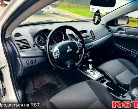 Белый Мицубиси Лансер, объемом двигателя 2 л и пробегом 185 тыс. км за 7999 $, фото 12 на Automoto.ua