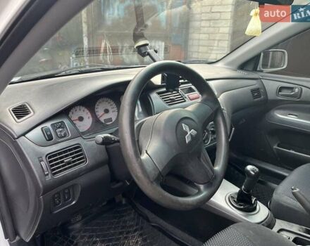 Білий Міцубісі Lancer, об'ємом двигуна 1.58 л та пробігом 250 тис. км за 4400 $, фото 1 на Automoto.ua