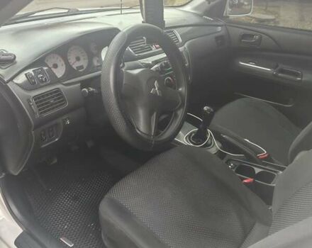 Белый Мицубиси Лансер, объемом двигателя 1.59 л и пробегом 222 тыс. км за 4950 $, фото 1 на Automoto.ua