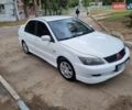 Білий Міцубісі Lancer, об'ємом двигуна 1.6 л та пробігом 213 тис. км за 4000 $, фото 1 на Automoto.ua