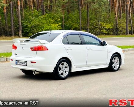 Белый Мицубиси Лансер, объемом двигателя 2 л и пробегом 185 тыс. км за 7999 $, фото 5 на Automoto.ua