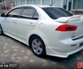 Білий Міцубісі Lancer, об'ємом двигуна 2 л та пробігом 258 тис. км за 6400 $, фото 3 на Automoto.ua