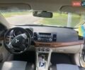 Белый Мицубиси Лансер, объемом двигателя 2 л и пробегом 167 тыс. км за 7400 $, фото 47 на Automoto.ua