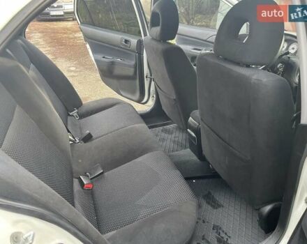 Білий Міцубісі Lancer, об'ємом двигуна 1.58 л та пробігом 250 тис. км за 4400 $, фото 2 на Automoto.ua
