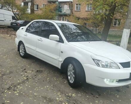 Белый Мицубиси Лансер, объемом двигателя 1.59 л и пробегом 222 тыс. км за 4950 $, фото 3 на Automoto.ua