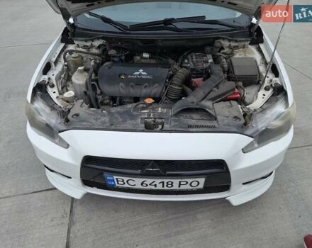 Белый Мицубиси Лансер, объемом двигателя 2 л и пробегом 218 тыс. км за 5555 $, фото 7 на Automoto.ua