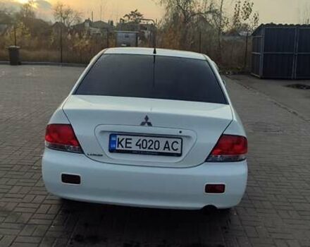 Білий Міцубісі Lancer, об'ємом двигуна 1.58 л та пробігом 250 тис. км за 4400 $, фото 6 на Automoto.ua