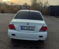 Білий Міцубісі Lancer, об'ємом двигуна 1.58 л та пробігом 250 тис. км за 4400 $, фото 6 на Automoto.ua