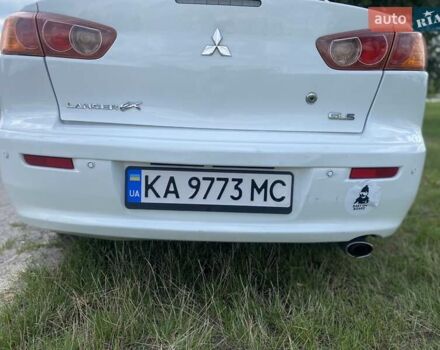 Белый Мицубиси Лансер, объемом двигателя 2 л и пробегом 167 тыс. км за 7400 $, фото 14 на Automoto.ua