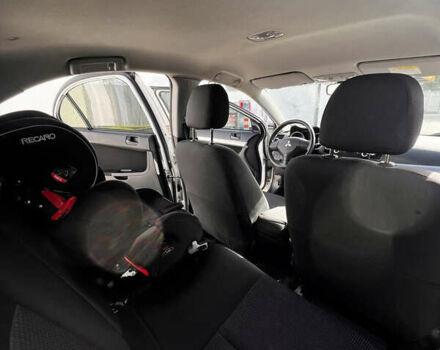 Белый Мицубиси Лансер, объемом двигателя 1.5 л и пробегом 135 тыс. км за 7500 $, фото 6 на Automoto.ua