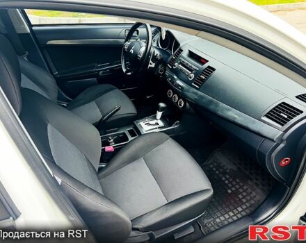 Белый Мицубиси Лансер, объемом двигателя 2 л и пробегом 185 тыс. км за 7999 $, фото 9 на Automoto.ua