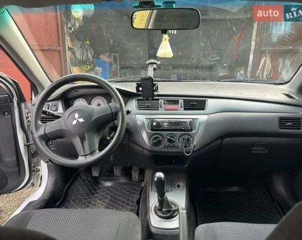 Білий Міцубісі Lancer, об'ємом двигуна 1.58 л та пробігом 250 тис. км за 4400 $, фото 4 на Automoto.ua