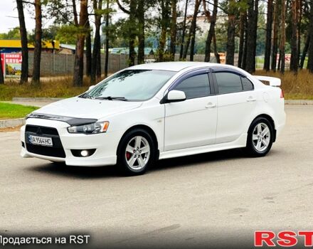 Белый Мицубиси Лансер, объемом двигателя 2 л и пробегом 185 тыс. км за 7999 $, фото 2 на Automoto.ua