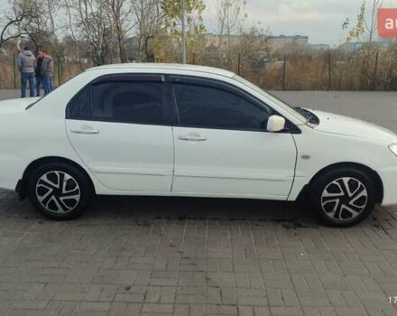 Білий Міцубісі Lancer, об'ємом двигуна 1.58 л та пробігом 250 тис. км за 4400 $, фото 7 на Automoto.ua