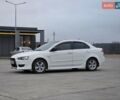 Белый Мицубиси Лансер, объемом двигателя 2 л и пробегом 218 тыс. км за 5555 $, фото 3 на Automoto.ua
