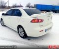 Білий Міцубісі Lancer, об'ємом двигуна 2 л та пробігом 210 тис. км за 7500 $, фото 3 на Automoto.ua