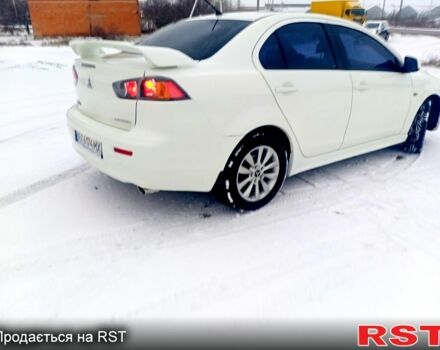 Білий Міцубісі Lancer, об'ємом двигуна 2 л та пробігом 210 тис. км за 7500 $, фото 2 на Automoto.ua