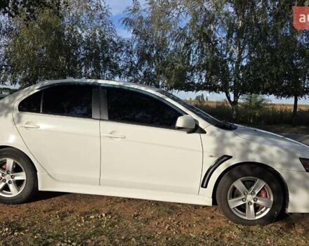 Білий Міцубісі Lancer, об'ємом двигуна 2 л та пробігом 185 тис. км за 7600 $, фото 4 на Automoto.ua