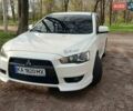 Белый Мицубиси Лансер, объемом двигателя 2 л и пробегом 144 тыс. км за 7000 $, фото 1 на Automoto.ua