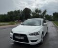 Белый Мицубиси Лансер, объемом двигателя 2 л и пробегом 236 тыс. км за 7100 $, фото 1 на Automoto.ua