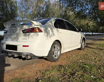 Білий Міцубісі Lancer, об'ємом двигуна 2 л та пробігом 185 тис. км за 7600 $, фото 3 на Automoto.ua