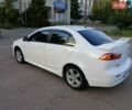 Белый Мицубиси Лансер, объемом двигателя 2 л и пробегом 240 тыс. км за 6999 $, фото 4 на Automoto.ua