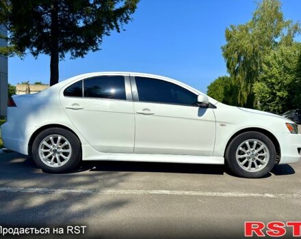 Белый Мицубиси Лансер, объемом двигателя 2 л и пробегом 240 тыс. км за 7500 $, фото 2 на Automoto.ua