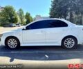 Белый Мицубиси Лансер, объемом двигателя 2 л и пробегом 240 тыс. км за 7500 $, фото 1 на Automoto.ua