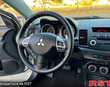 Білий Міцубісі Lancer, об'ємом двигуна 20 л та пробігом 183 тис. км за 9899 $, фото 4 на Automoto.ua