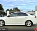 Білий Міцубісі Lancer, об'ємом двигуна 20 л та пробігом 183 тис. км за 9899 $, фото 1 на Automoto.ua