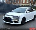 Білий Міцубісі Lancer, об'ємом двигуна 2 л та пробігом 225 тис. км за 8000 $, фото 1 на Automoto.ua